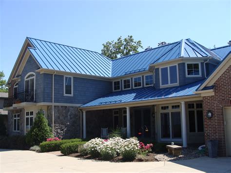 blue house with metal roof|blue corrugated roofing.